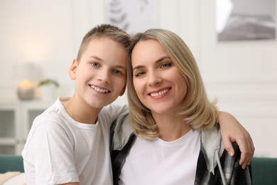 Photo of Portrait of happy son and mom indoors