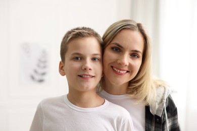 Photo of Portrait of happy mother and son indoors