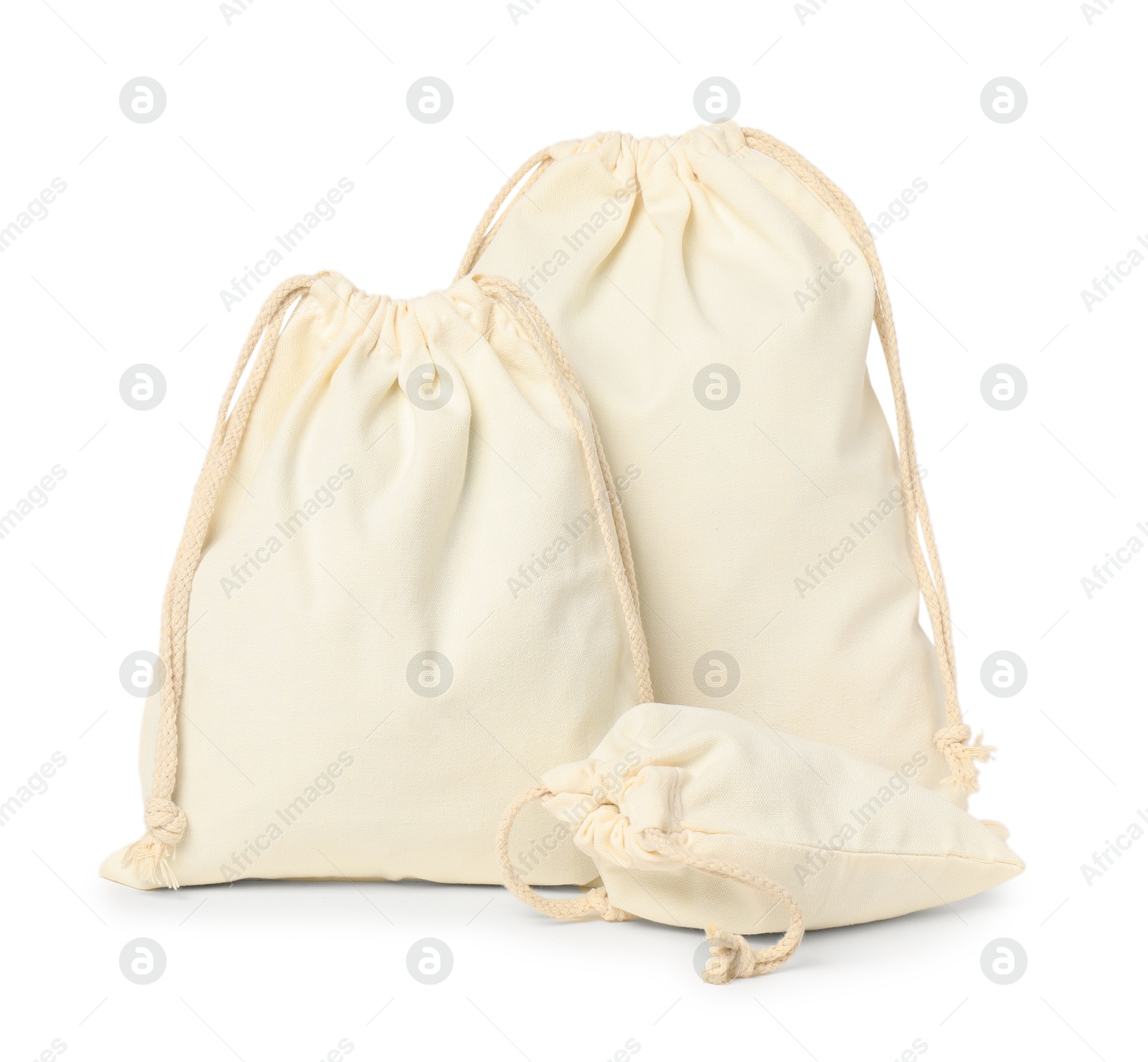 Photo of Cotton bags of different sizes isolated on white