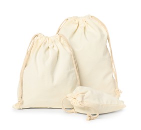 Photo of Cotton bags of different sizes isolated on white