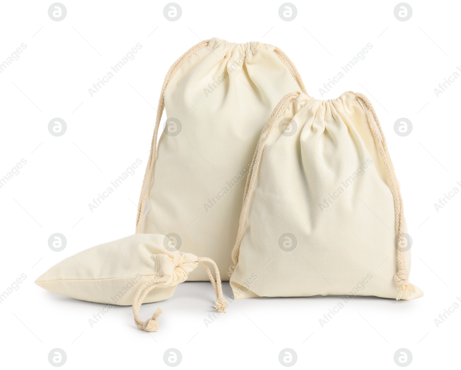 Photo of Cotton bags of different sizes isolated on white