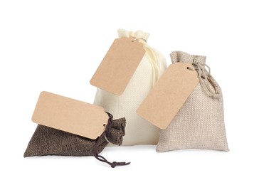 Photo of Burlap bags with tags isolated on white