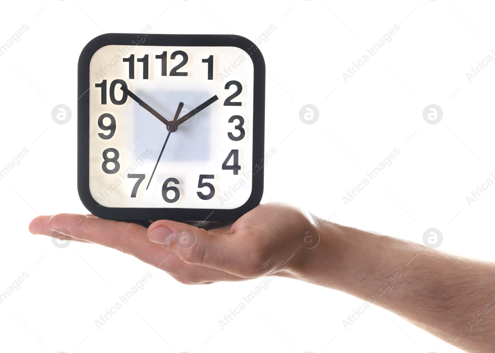 Photo of Man with alarm clock on white background, closeup