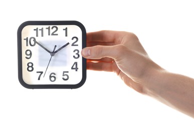 Photo of Man with alarm clock on white background, closeup