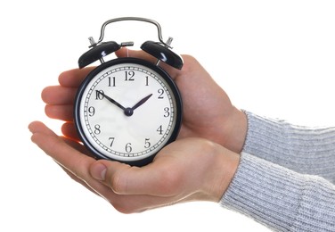 Photo of Man with black alarm clock on white background, closeup