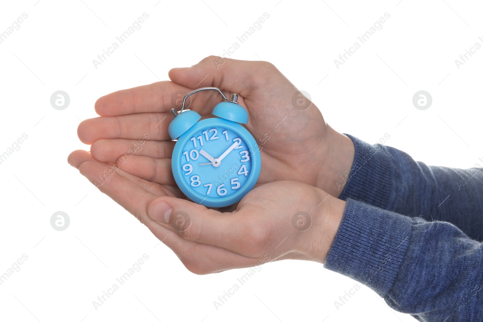 Photo of Man with light blue alarm clock on white background, closeup