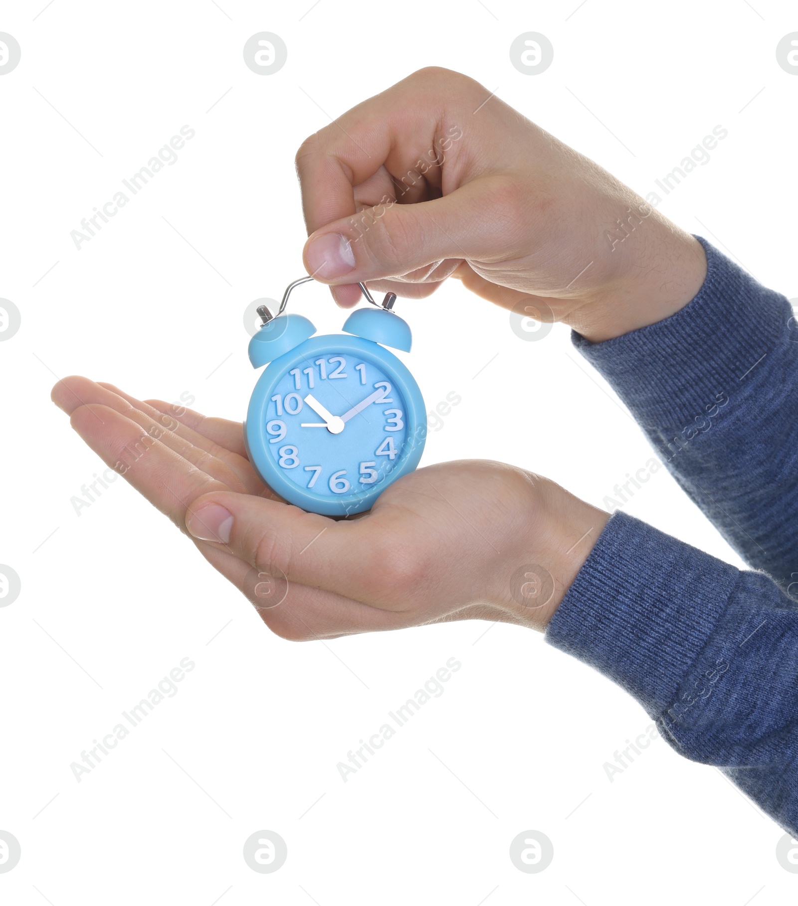 Photo of Man with light blue alarm clock on white background, closeup