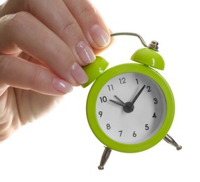 Photo of Woman with alarm clock on white background, closeup