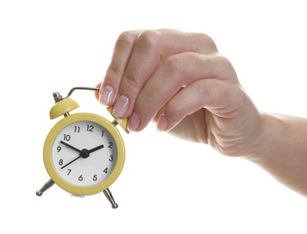 Woman with alarm clock on white background, closeup