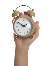 Photo of Woman with alarm clock on white background, closeup