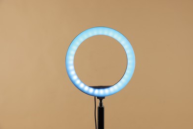 Photo of Ring lamp on stand against beige background