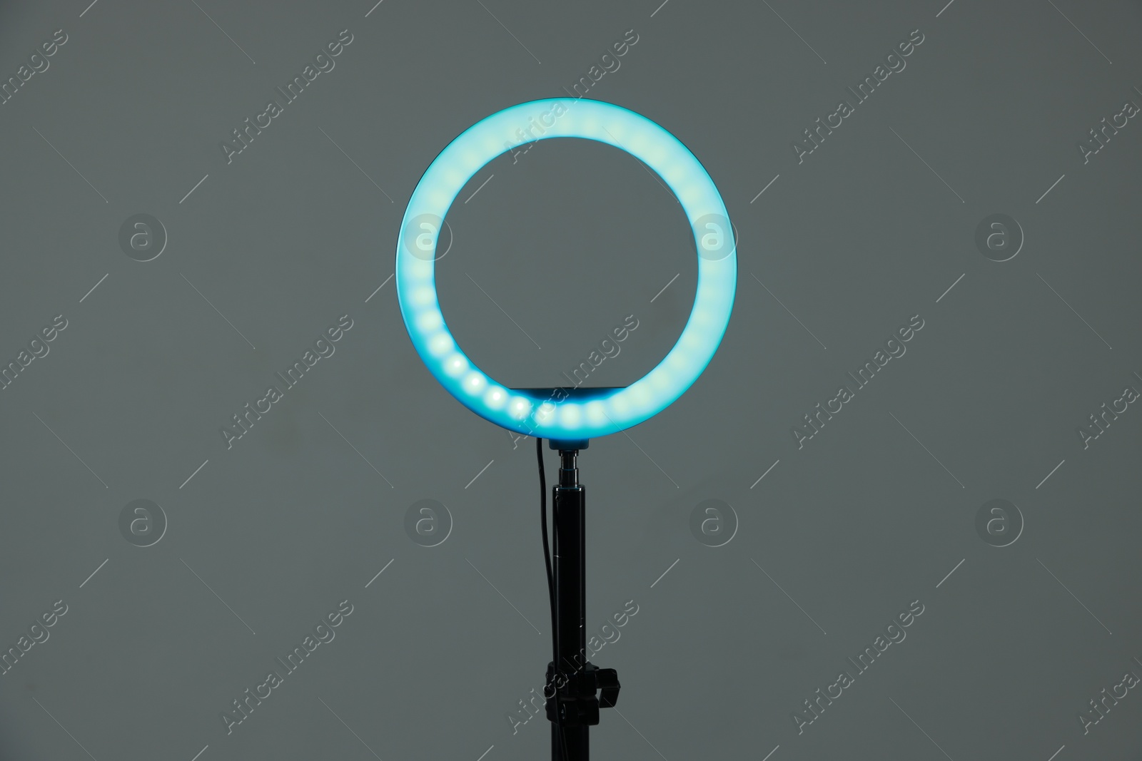 Photo of Ring lamp on stand against grey background