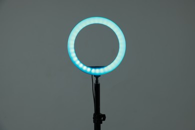 Photo of Ring lamp on stand against grey background