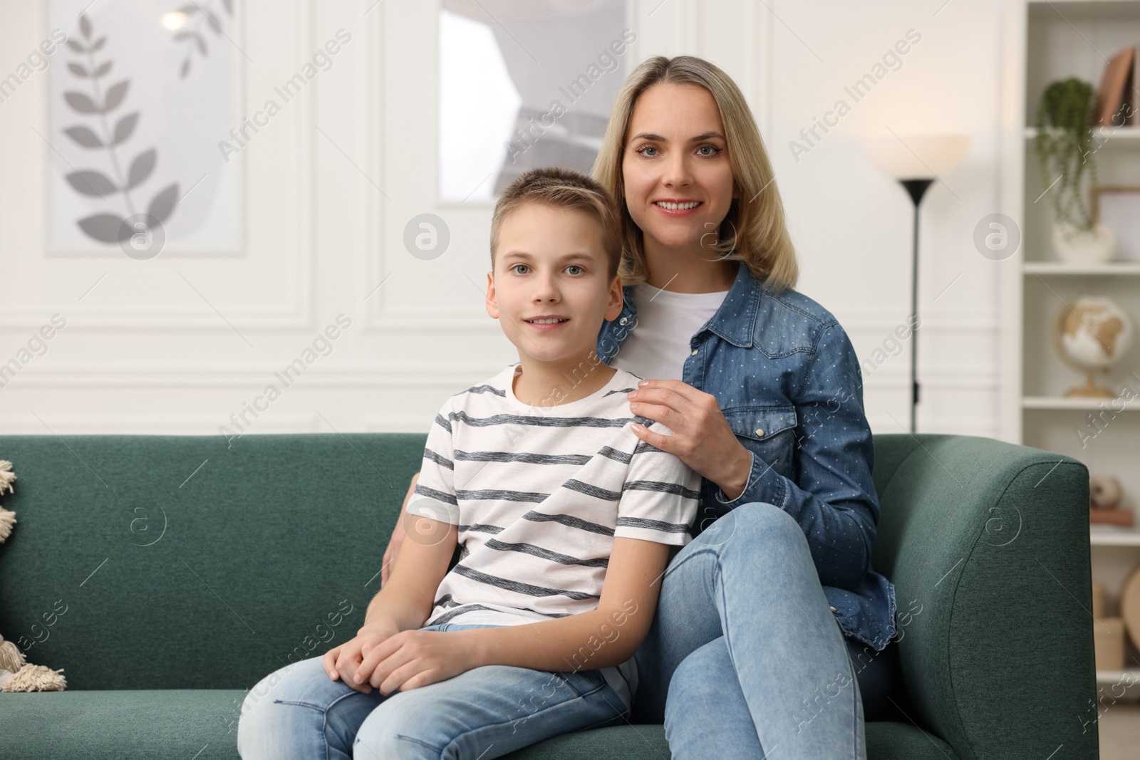 Photo of Mother and son on sofa at home