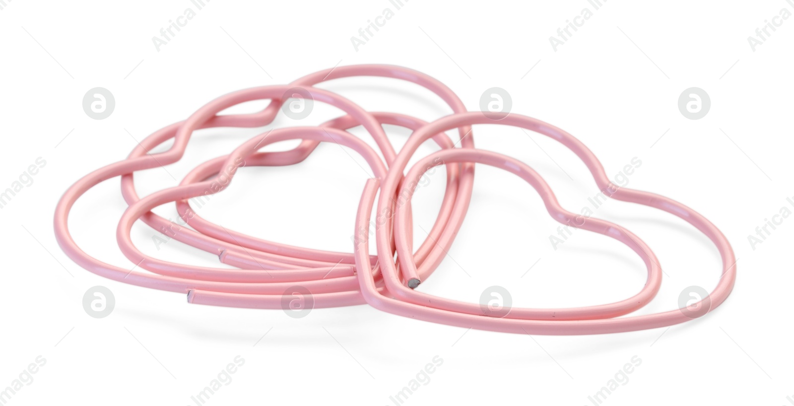 Photo of Heart shaped paper clips isolated on white