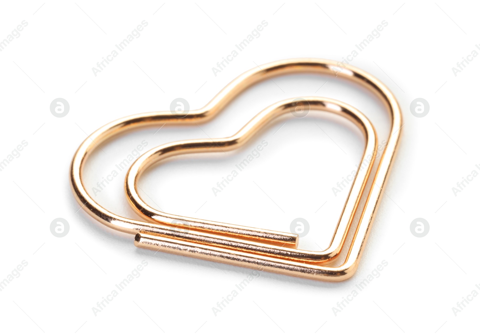 Photo of Heart shaped paper clip isolated on white