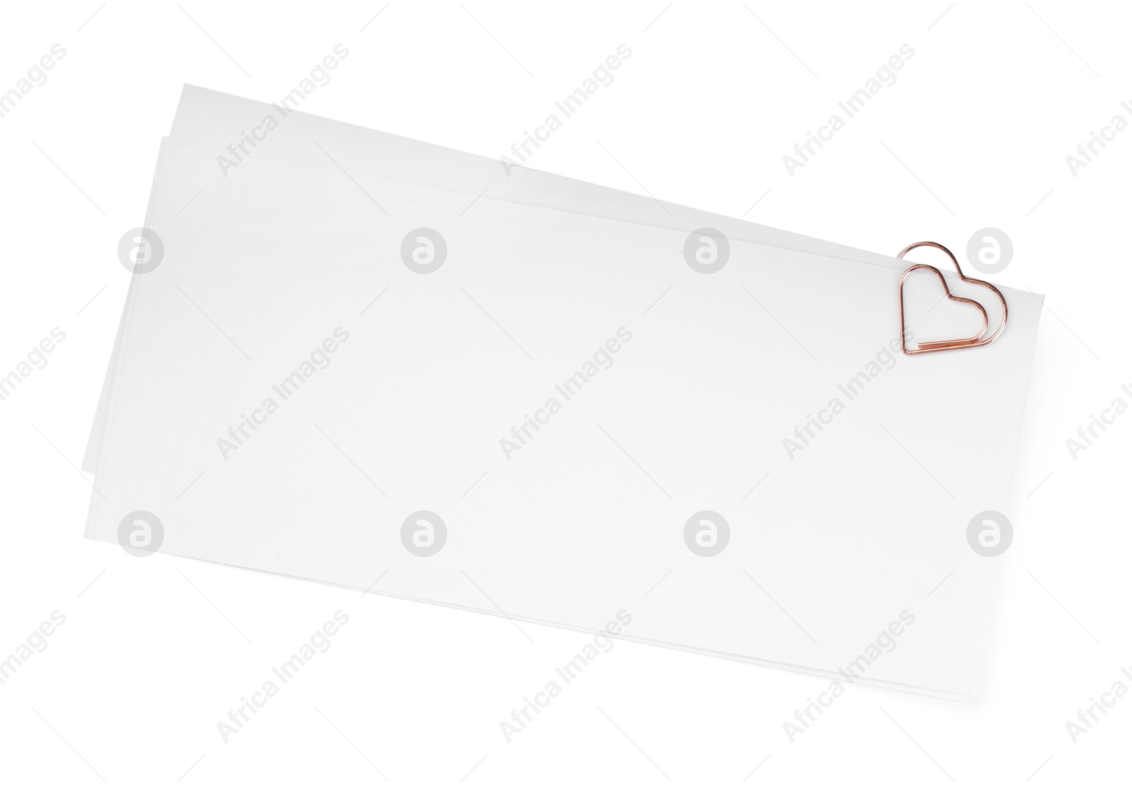 Photo of Blank paper sheet attached with clip isolated on white, top view