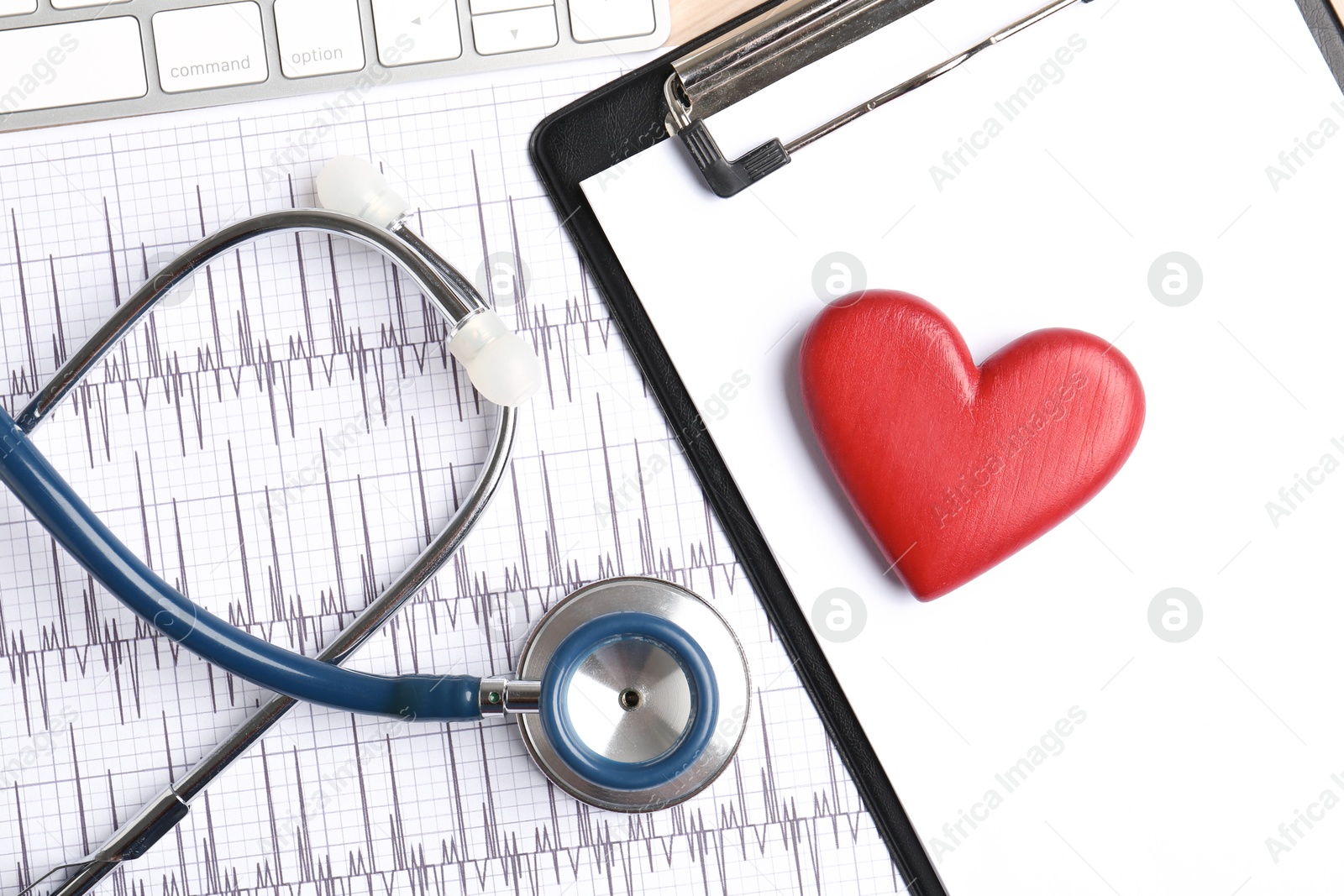 Photo of Cardiology. Cardiogram, clipboard, stethoscope, keyboard and red decorative heart on table, flat lay