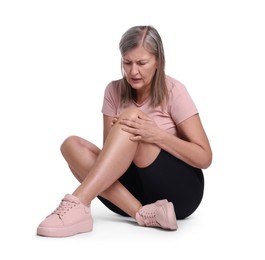 Photo of Senior woman suffering from knee pain on white background