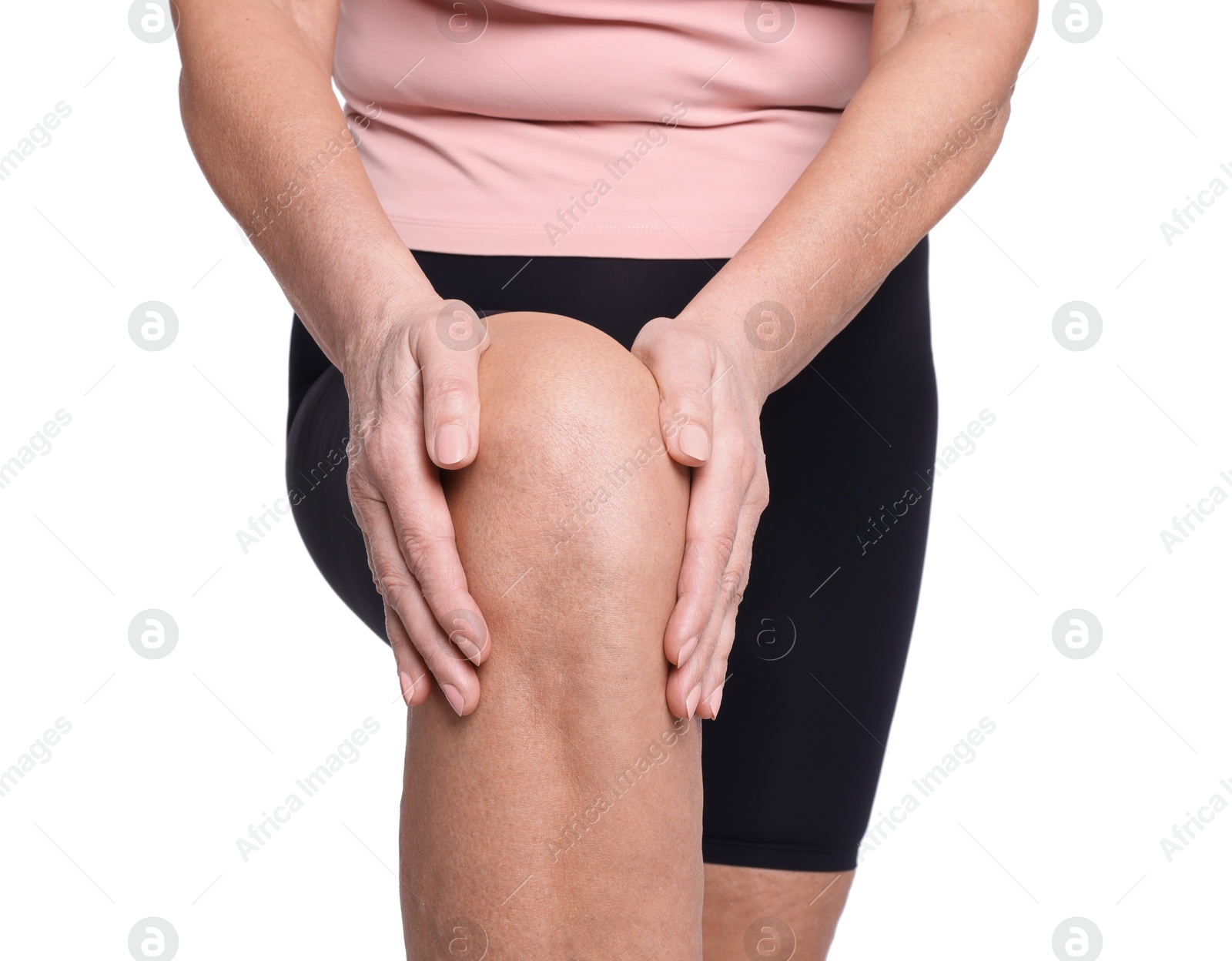 Photo of Woman suffering from pain in her knee on white background, closeup