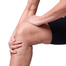 Photo of Woman suffering from pain in her knee on white background, closeup