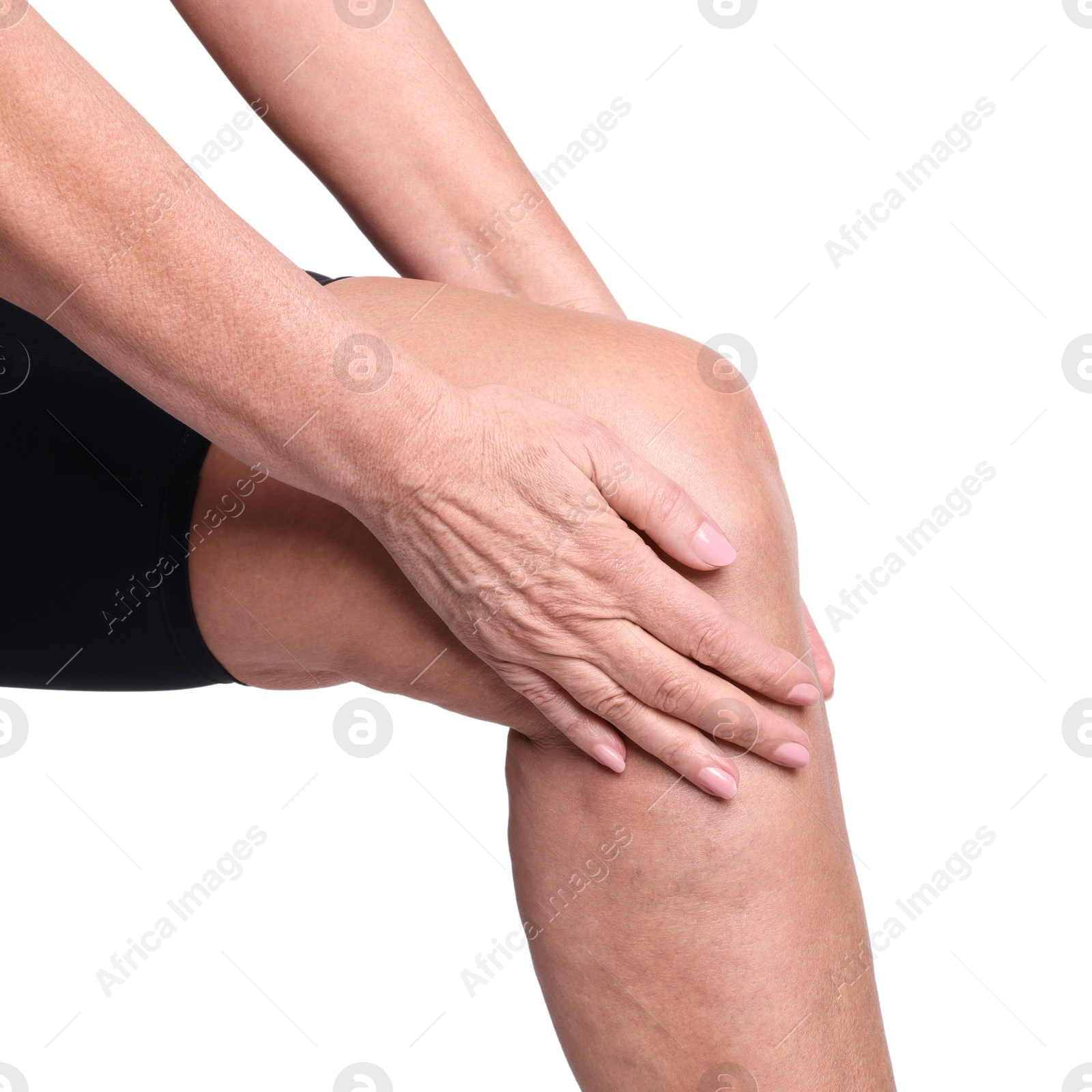 Photo of Woman suffering from pain in her knee on white background, closeup