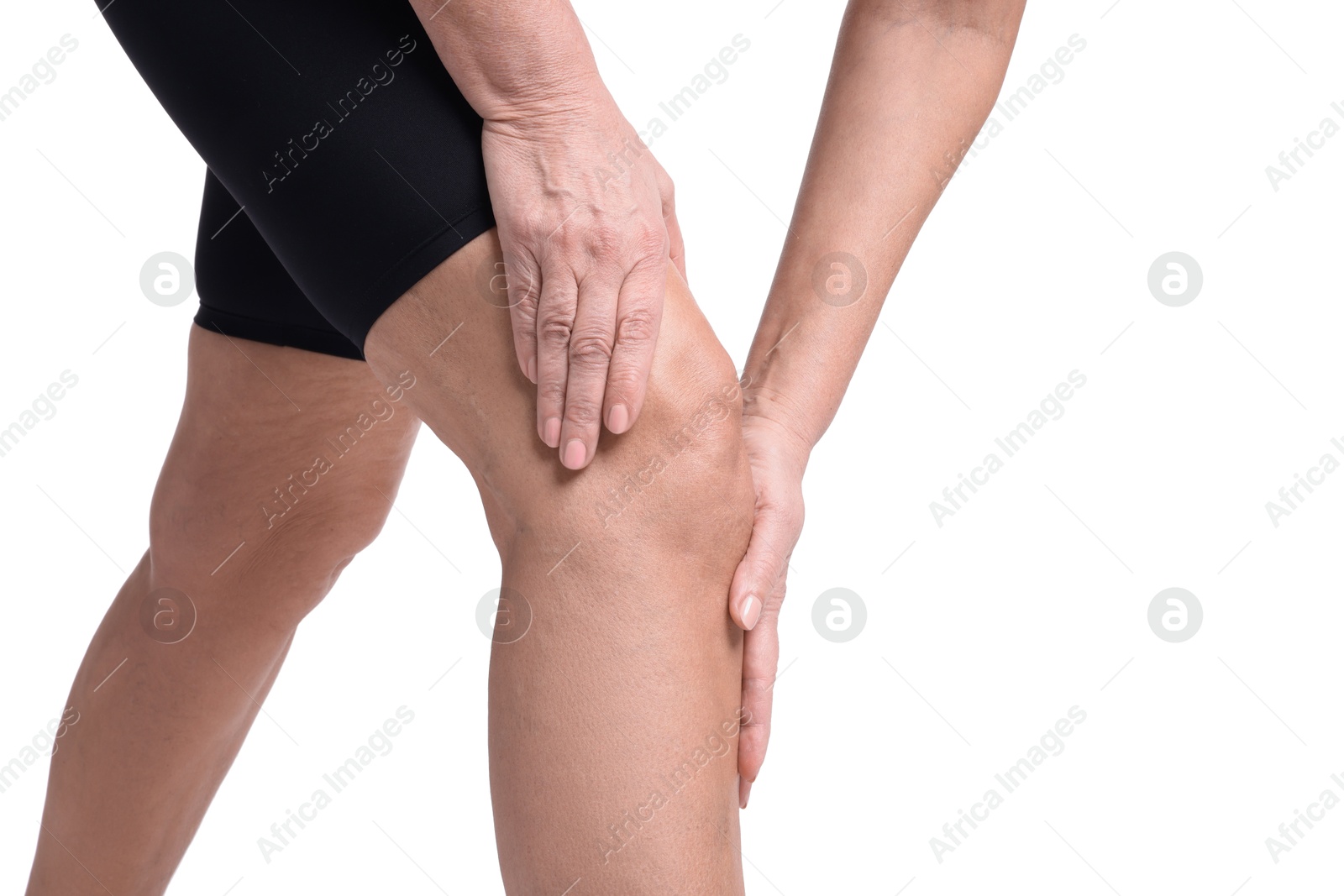 Photo of Woman suffering from pain in her knee on white background, closeup