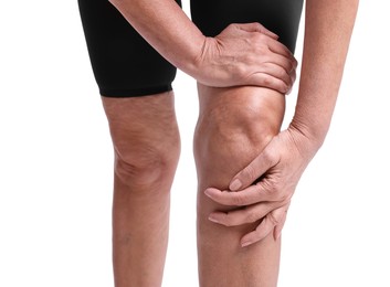 Photo of Woman suffering from pain in her knee on white background, closeup