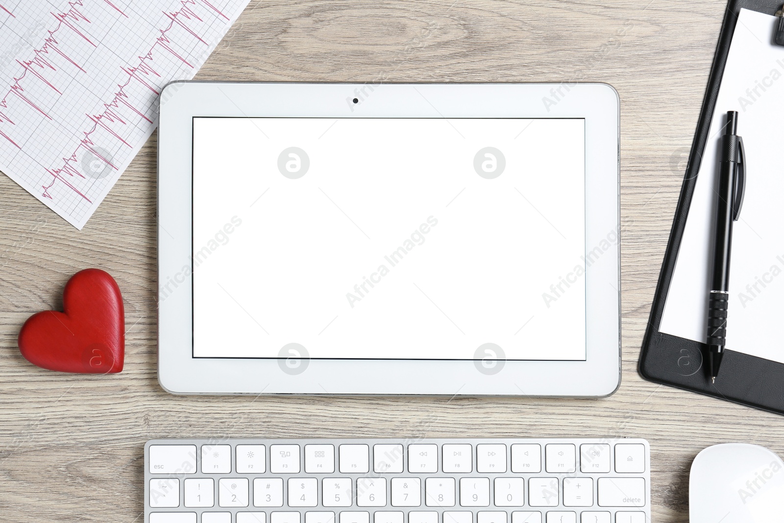 Photo of Cardiology. Flat lay composition with stethoscope and tablet on wooden table