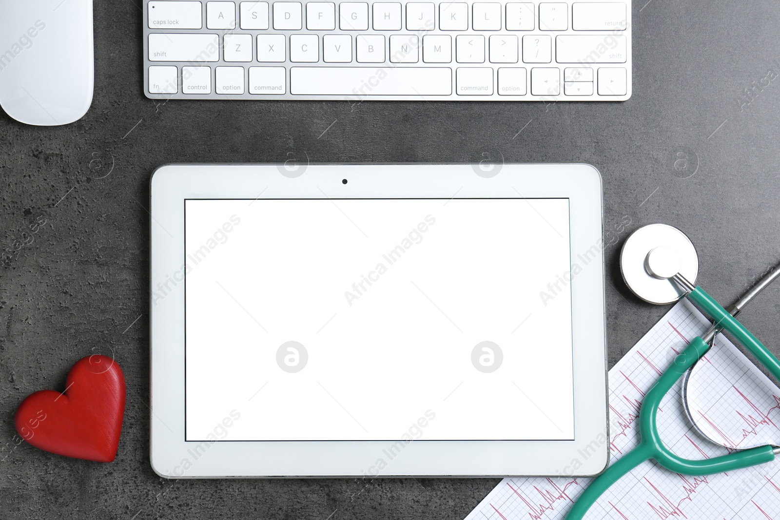 Photo of Cardiology. Flat lay composition with stethoscope and tablet on gray textured table