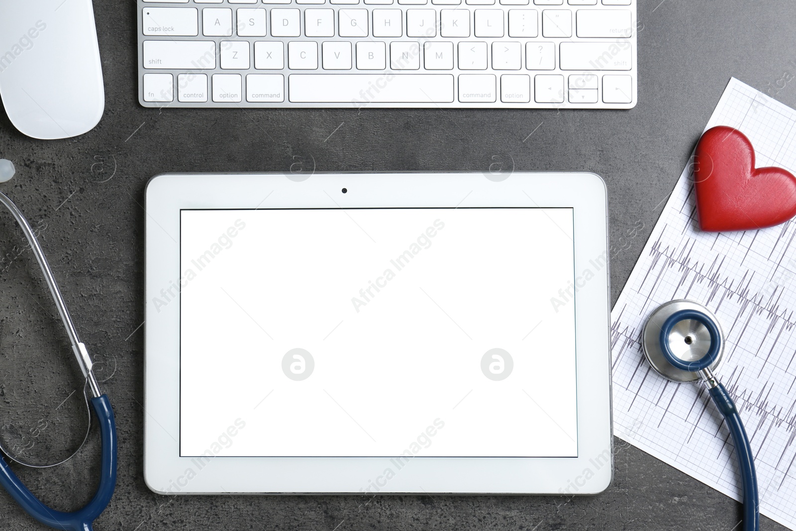 Photo of Cardiology. Flat lay composition with stethoscope and tablet on gray textured table