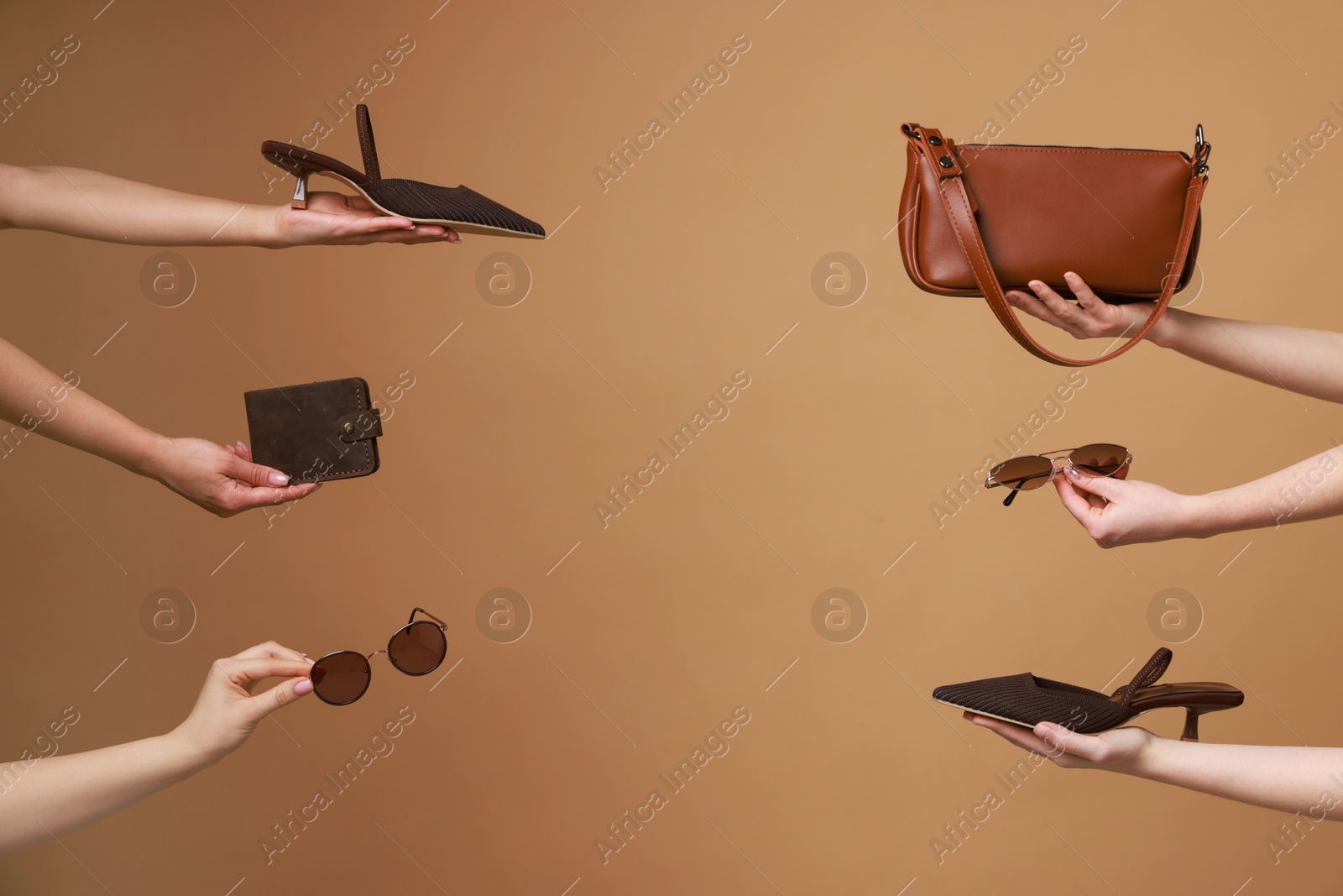 Photo of Women with stylish accessories and shoes on brown background, closeup. Space for text