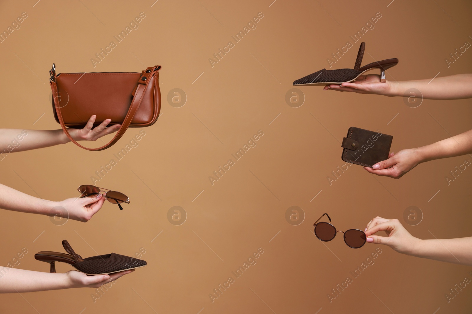 Photo of Women with stylish accessories and shoes on brown background, closeup. Space for text