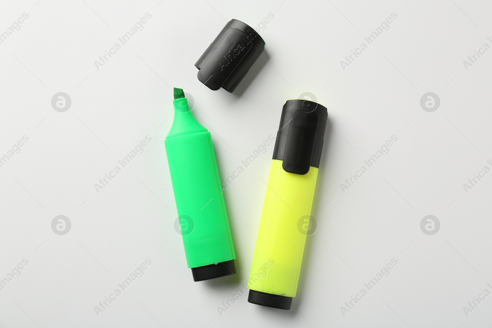 Photo of Bright highlighters on white background, flat lay