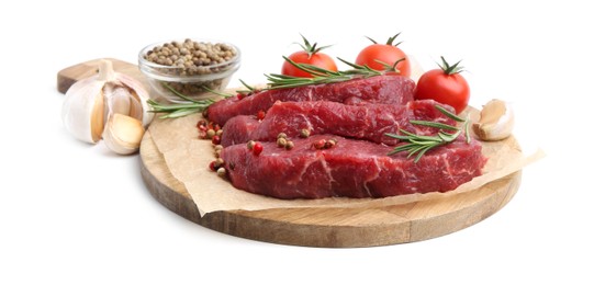 Photo of Pieces of raw beef meat, spices and tomatoes isolated on white