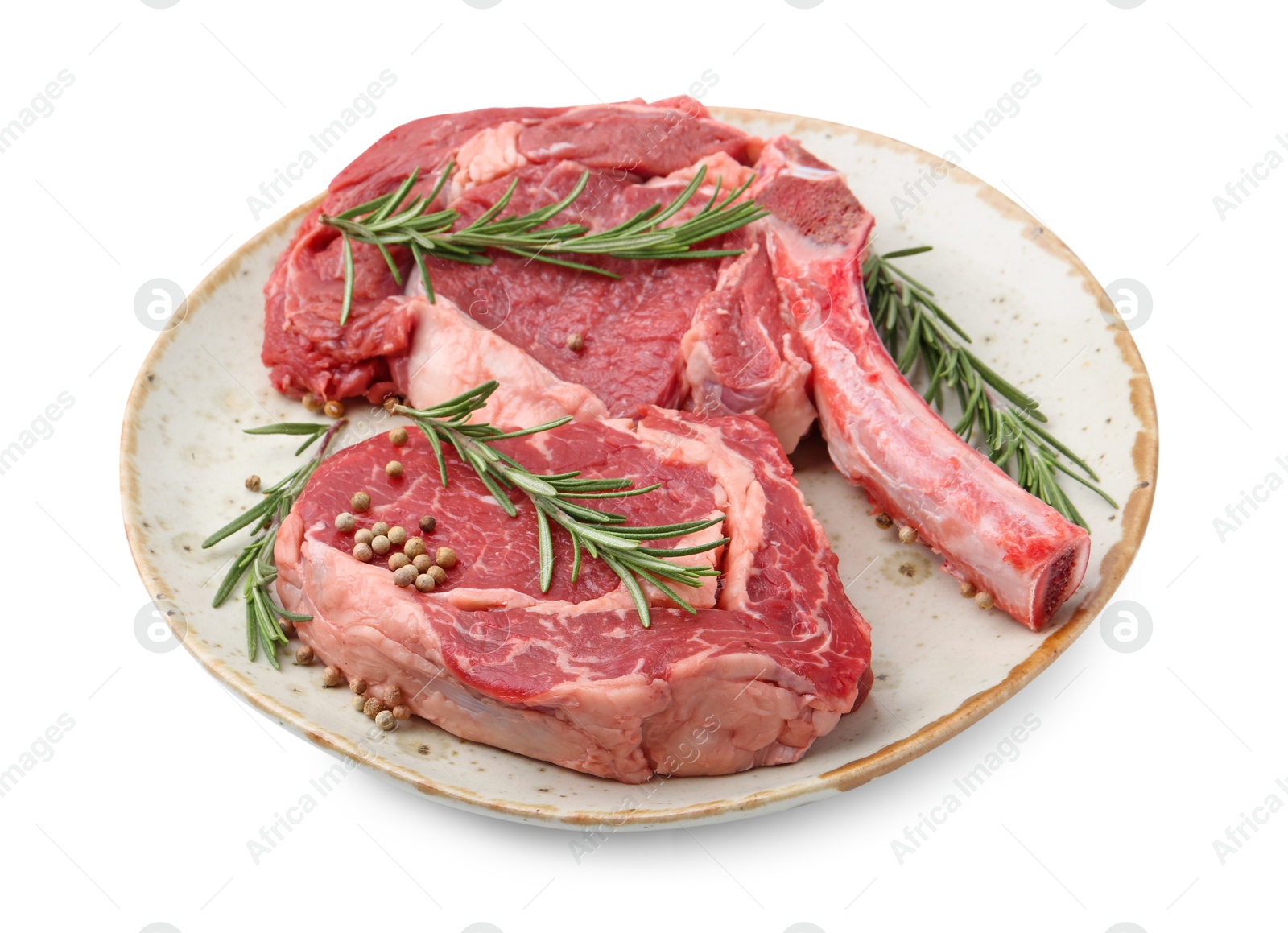 Photo of Pieces of raw beef meat and spices isolated on white