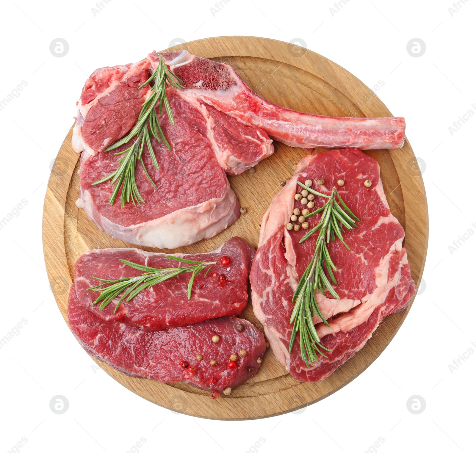 Photo of Pieces of raw beef meat and spices isolated on white, top view