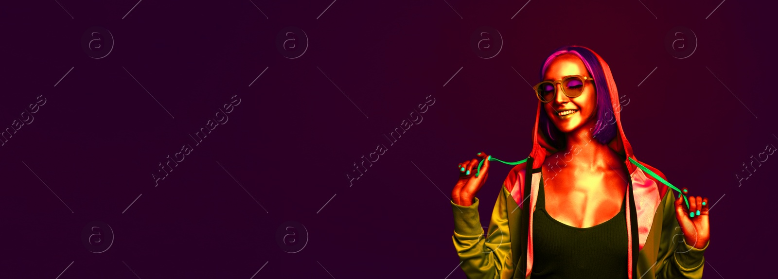 Image of Beautiful young woman in neon light, space for text. Banner design