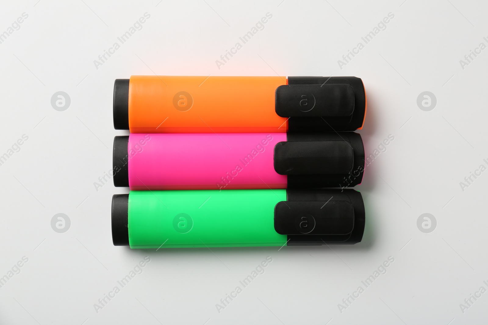 Photo of Bright highlighters on white background, flat lay