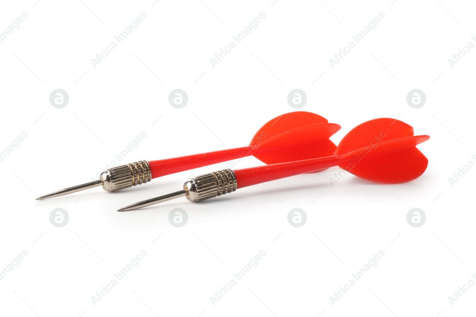 Photo of Red dart arrows isolated on white. Sports equipment