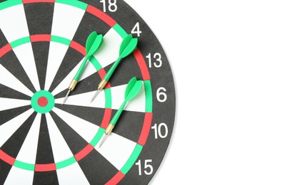 Photo of Dartboard and arrows isolated on white, top view. Sports equipment