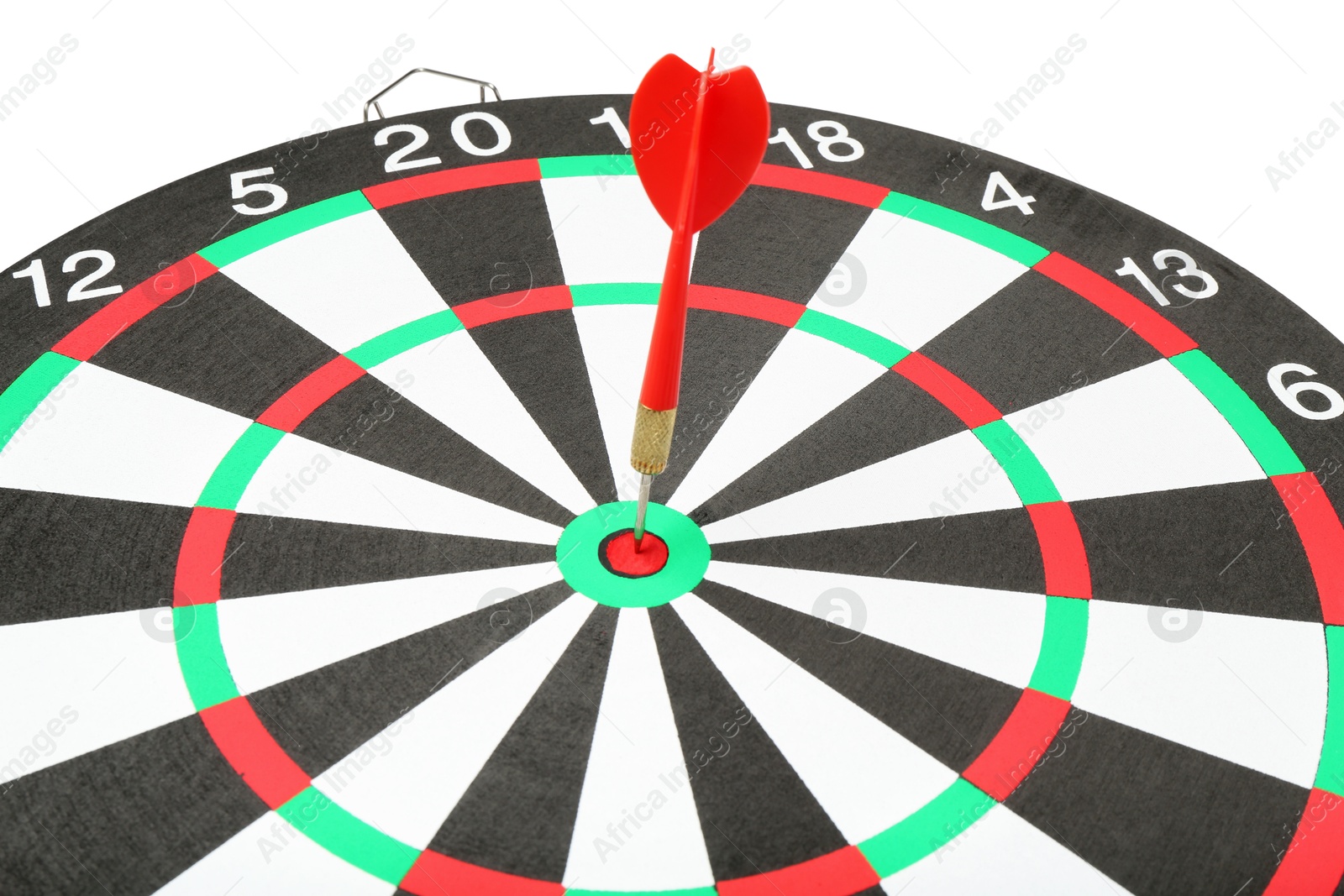 Photo of Dart board with red arrow hitting target on white background