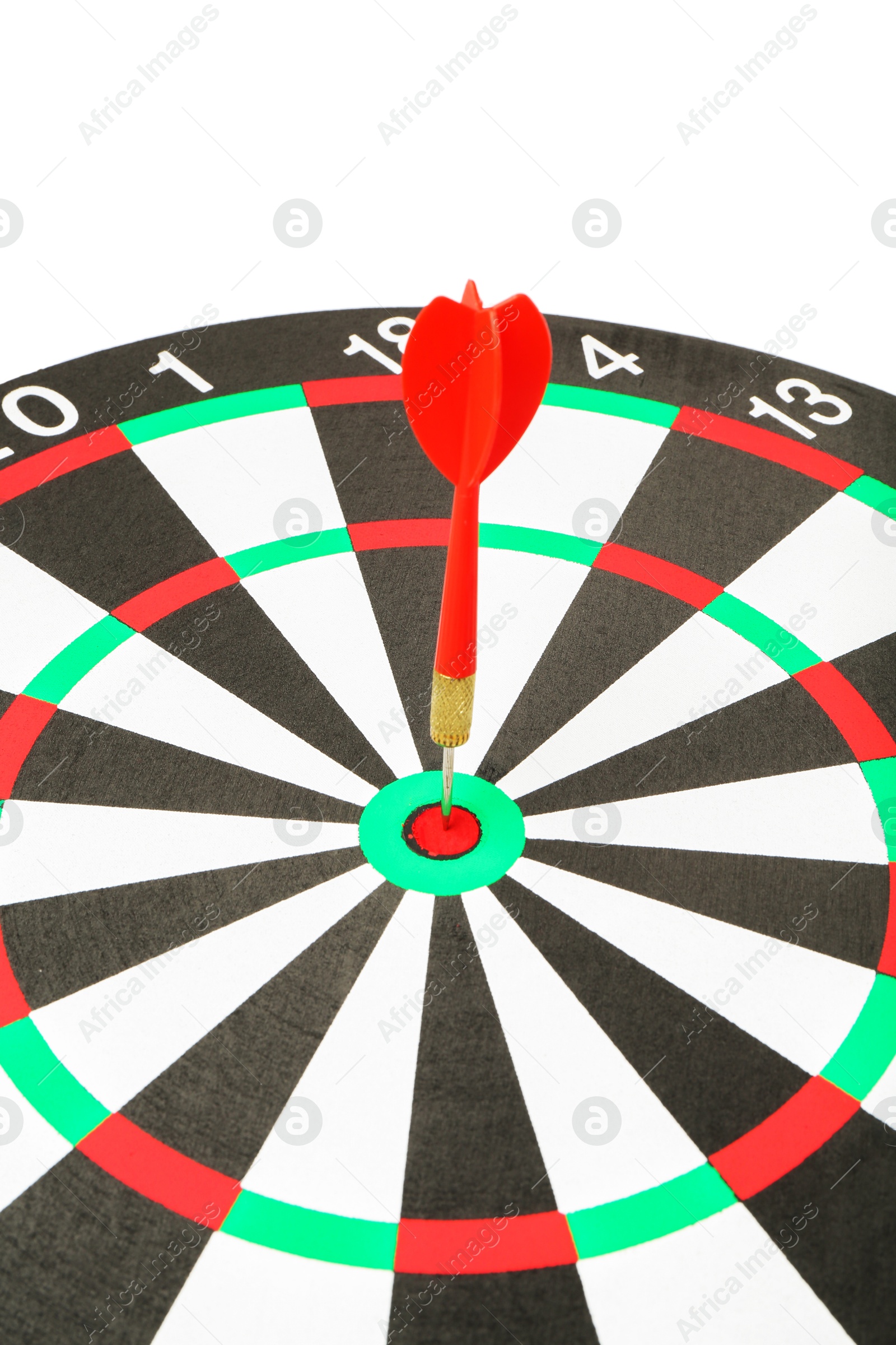 Photo of Dart board with red arrow hitting target on white background