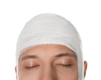 Photo of Man with head wrapped in medical bandage on white background, closeup