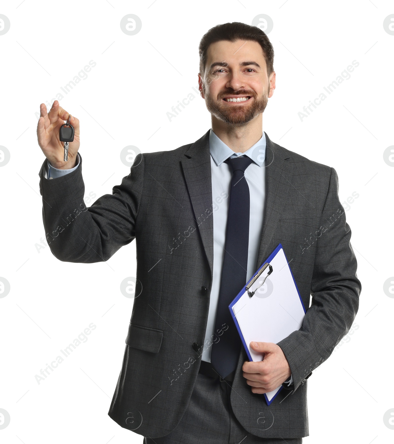 Photo of Cheerful salesman with car key and clipboard on white background