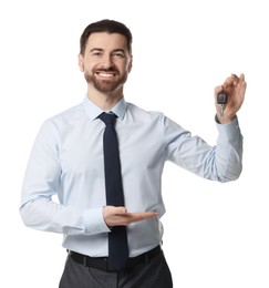 Photo of Cheerful salesman with car key on white background