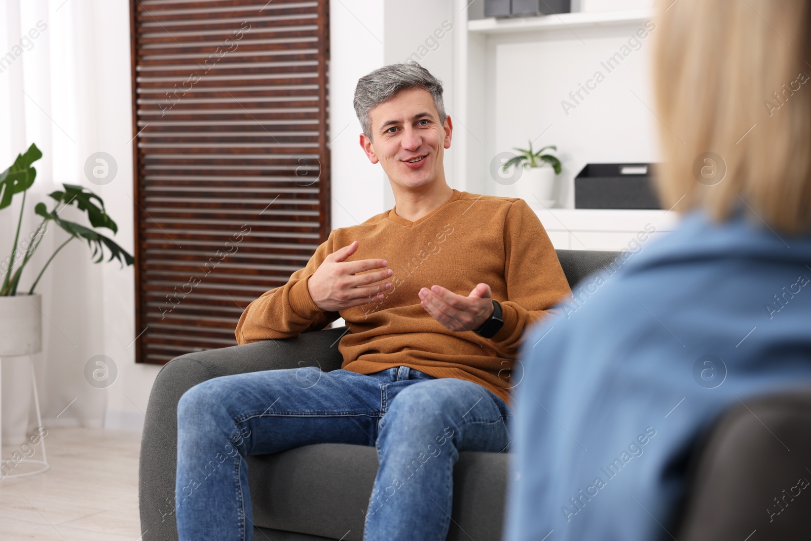 Photo of Professional psychologist working with patient in office