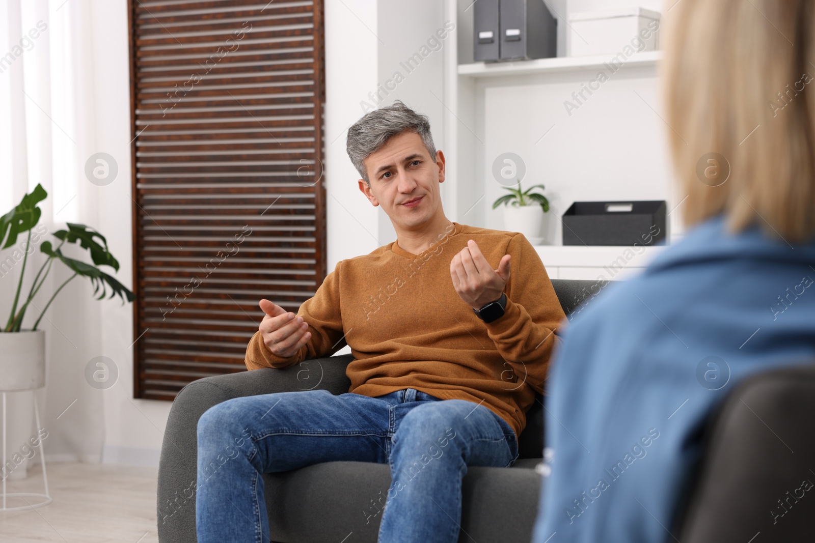 Photo of Professional psychologist working with patient in office