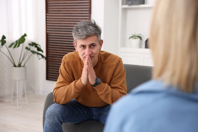 Photo of Professional psychologist working with patient in office, closeup