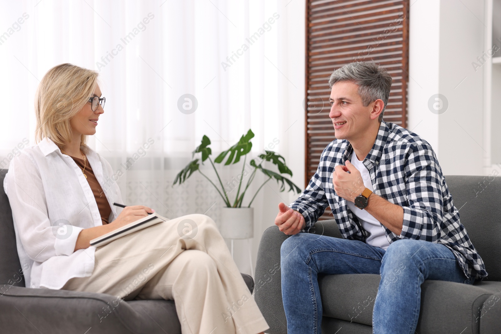 Photo of Professional psychologist working with patient in office